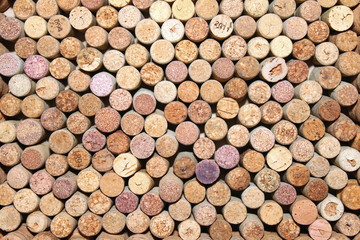 many different wine corks in the background