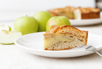 Homemade apple custard pie on white table