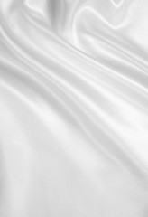 Fototapeta na wymiar Smooth elegant white silk as wedding background