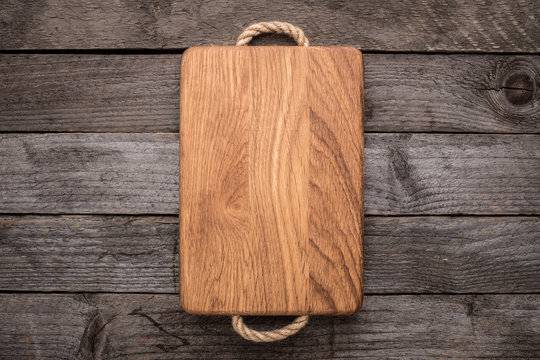 Chopping board on rustic table