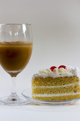 White coffee cake on a white table.