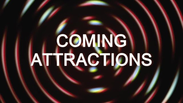 The text Coming attractions appears over a set of spinning circles with a lens flare at the beginning. Grindhouse low-budget b-movie style.
