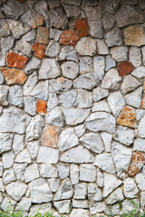 Texture old rock wall made of random stone
