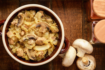 Stewed cabbage with meat and mushrooms.