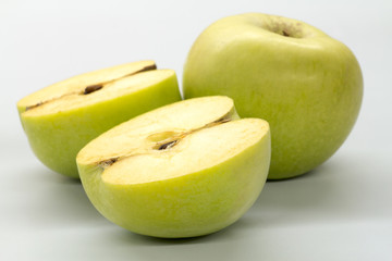 Apple green on a white table.