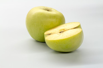 Apple green on a white table.