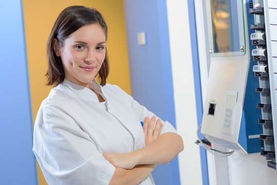 Portrait of woman at clocking in machine