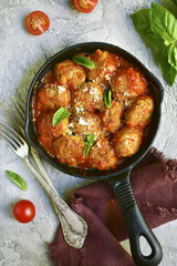 Meatballs in tomato sauce in a skillet.Top view.