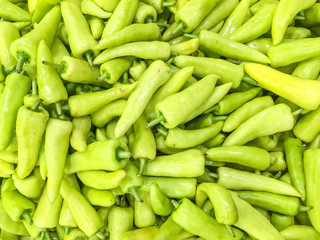 Closeup surface pile of green pepper , bell pepper or sweet pepper textured background