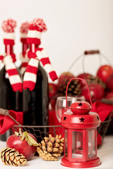 Merry Christmas and happy New year. Bottles of wine in a knitted