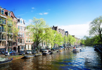 Fototapeta na wymiar Facades of dutch houses over canal, Amstardam scenery, Netherlands, retro toned