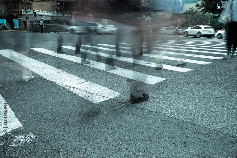 Wall mural crosswalk and pedestrian at modern city zebra crossing street. blur abstract.