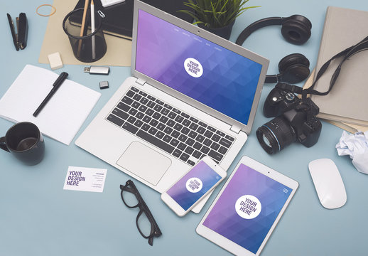 Laptop, Smartphone, and Tablet with Stationery on Blue-Gray Surface 4