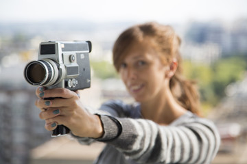 Young woman with vintage camera