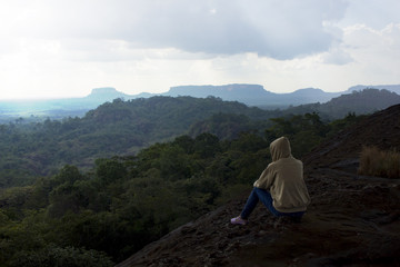 Fototapeta premium woman sitting and looking at the sky