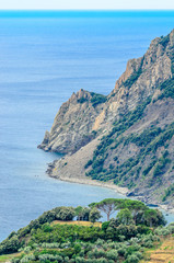 Fototapeta na wymiar Majestic mountain ocean view from famous trail between Monterosso and Vernazza, Italy.