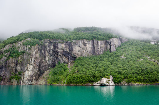 Fjord rocks with vertical cliffs and amazing beautiful water.
