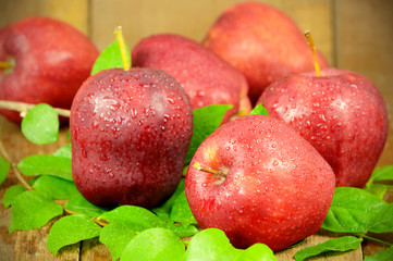 Red Apples on Wooden Background.