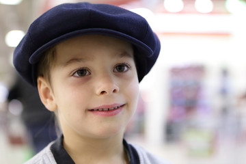 Boy in large cap