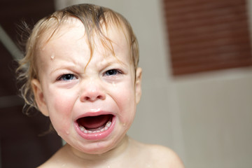 Child crying in bath