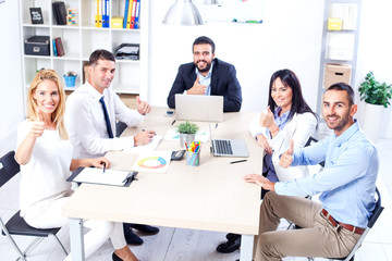 Group Of Business People Having Meeting In Office. Business partners discussing documents and ideas at meeting