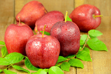 Red Apples on Wooden Background.