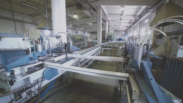 Welding of PVC profiles. Welding of PVC window profile. Welding machine for windows. Automatic production. The equipment in the enterprise. PVC window production technology.