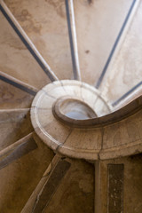 Fototapeta premium antique spiral ladder from marble stone