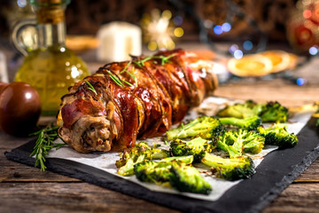 Veal roll rolled with prosciutto and filled with seeds and feta
