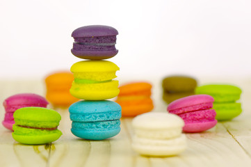 Perspective view of Macaroons on wood table.