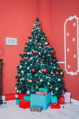 Beautiful new year room with decorated Christmas tree, gifts and fireplace. The idea for postcards. Soft focus. Shallow DOF