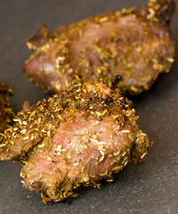 Pork cheeks with species on a stone slate