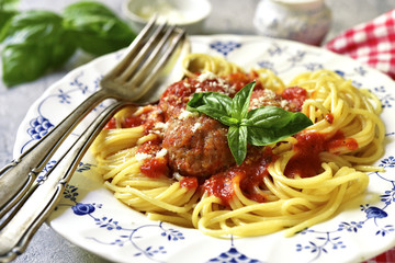 Meatballs in tomato sauce with spaghetti.
