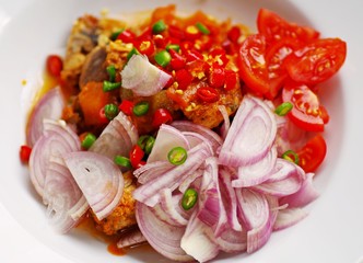 Homemade spicy canned sardine salad with red onion and tomatoes, original thai food.