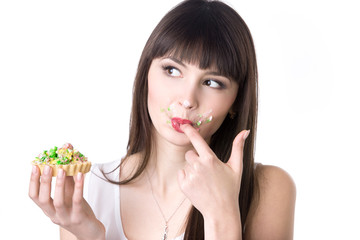 Attractive woman eating cake