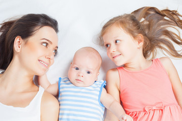 Happy mother with her children looking at camera