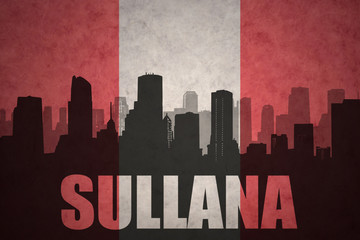 abstract silhouette of the city with text Sullana at the vintage peruvian flag