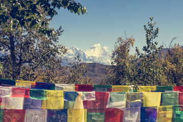Many buddhist prayer flags blowing in the wind.