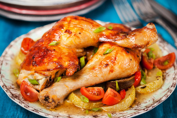 Roasted chicken legs with vegetables