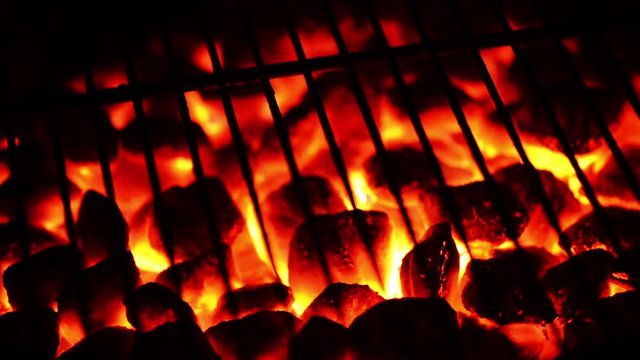 Grill at night, hot coal and embers. 