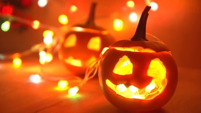 Halloween pumpkin head Jack lantern with lights on a dark background. Halloween holidays art design, celebration.