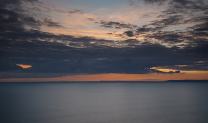 Naklejka premium Seascape of sunset and ocean. Whitsands Bay, Cornwall, UK.