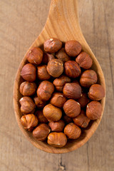 hazelnuts on wooden surface