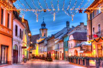 Michael Weiss street and ornamental lights in Christmas market of Brasov, medieval town of...