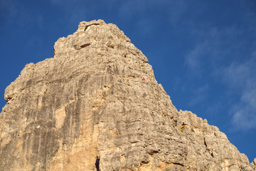 Fototapeta na wymiar Vertical walls with climber Cinque Torri