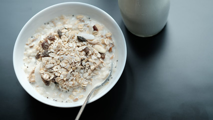 Morning granola breakfast with raisins and almond served with premium almond milk