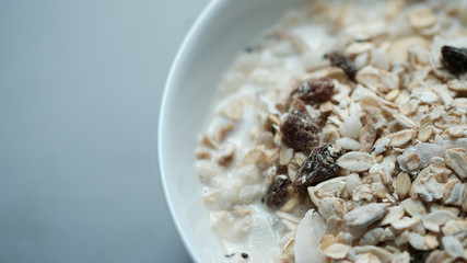 Morning granola breakfast with raisins and almond served with premium almond milk
