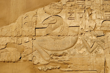 Ancient Egypt. The wall are decorated with carved hieroglyphs. Karnak Temple. Luxor. Thebes.