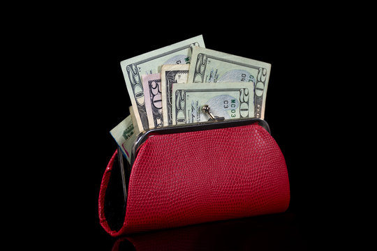 American Money In Red Purse Isolated On Black