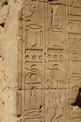 Ancient Egypt. The wall are decorated with carved hieroglyphs. Karnak Temple. Luxor. Thebes.